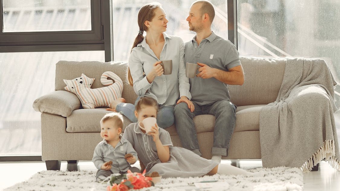 Happy family enjoying peaceful time together, representing the transformative journey from conflict to cooperation